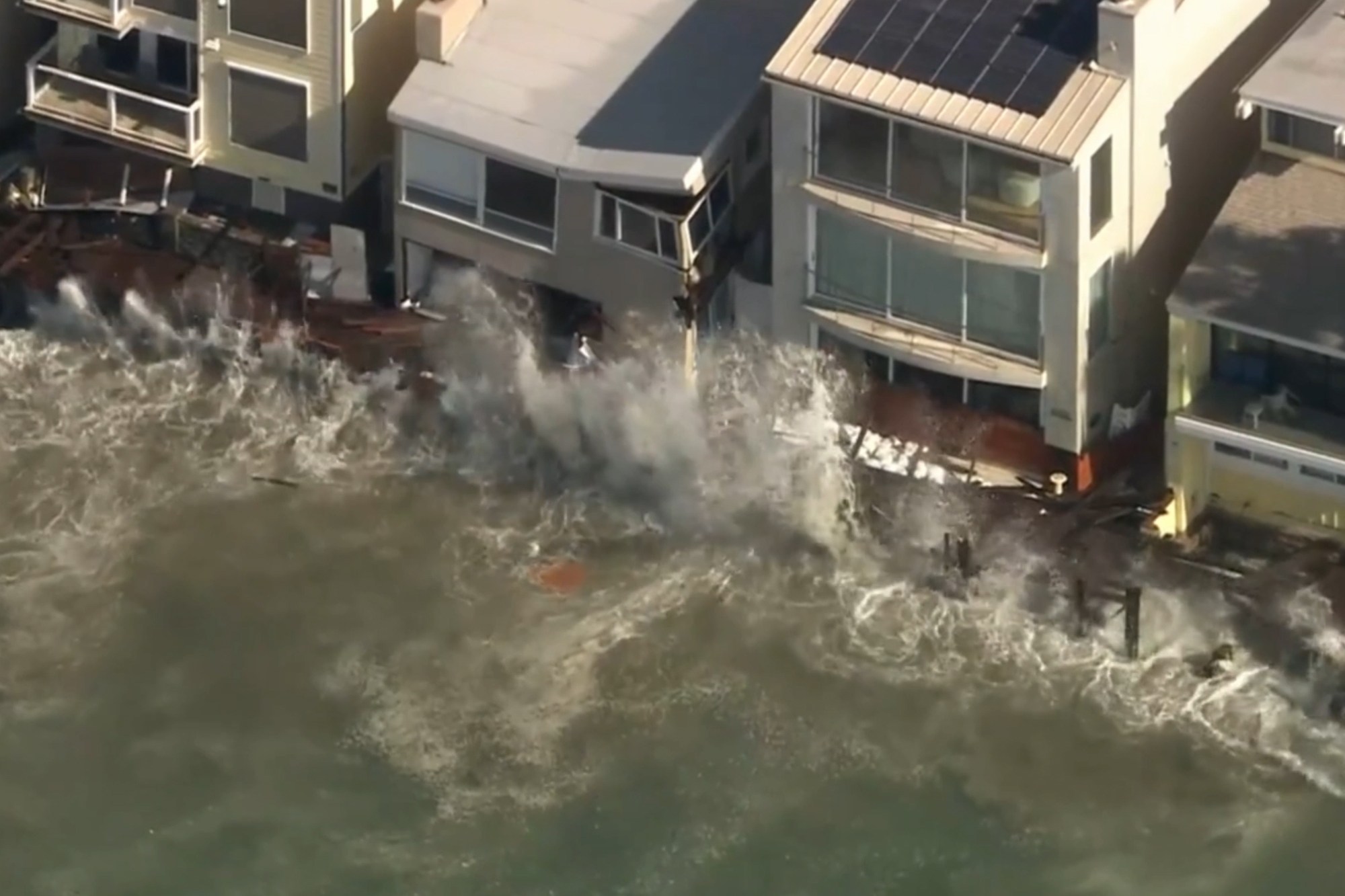 Beachfront home on brink of collapse as tropical storm batters Southern California