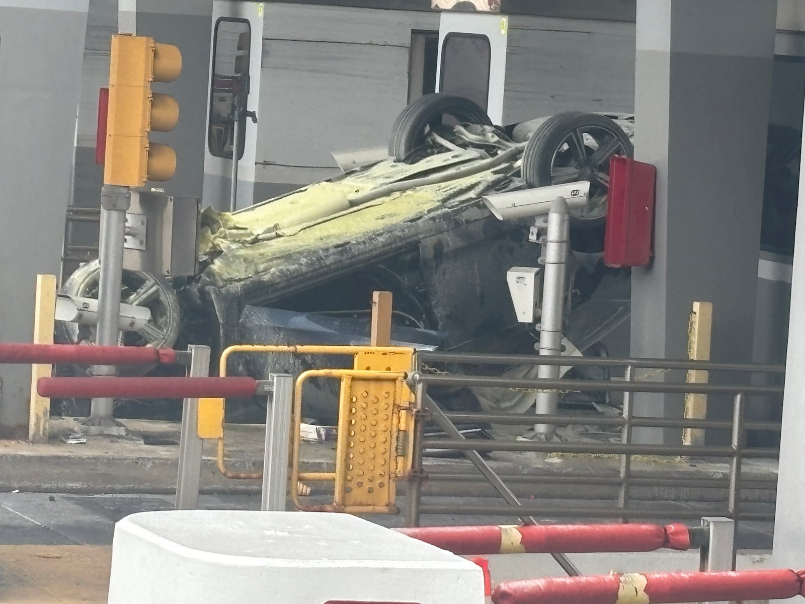 Paramedics pulled a N.J. woman from her burning car after a frightening rollover at a toll plaza