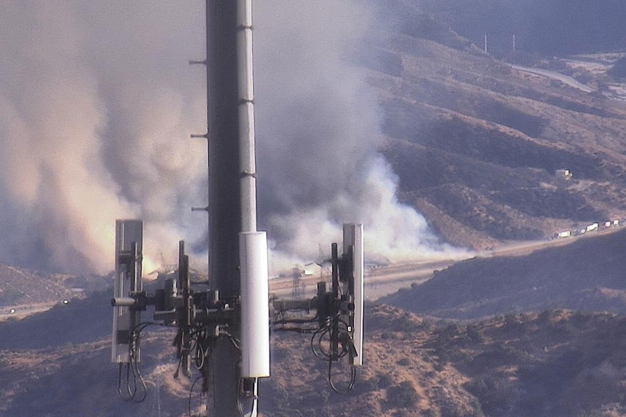 Fast-moving wildfire shuts down major California freeway as flames rage